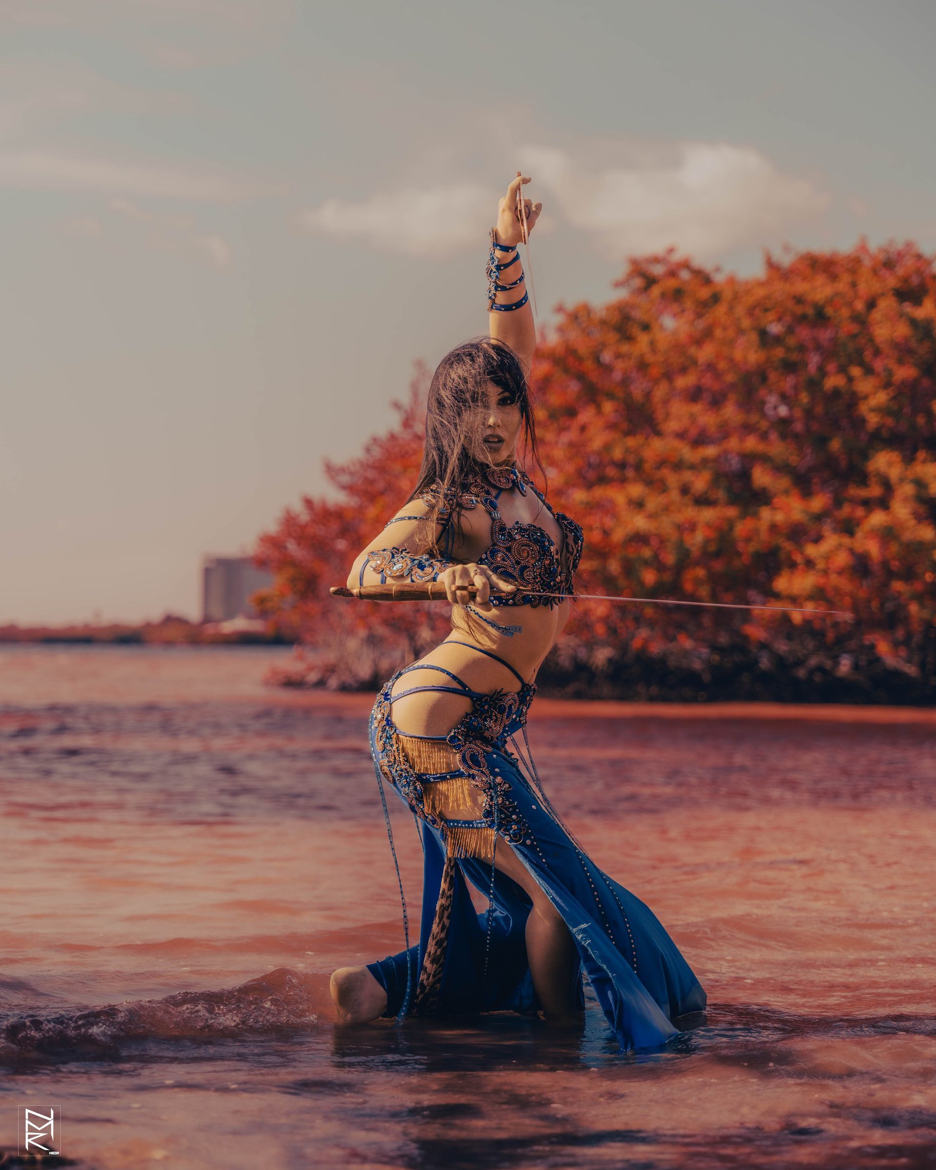 A photoshoot of the Belly Dancer Azeeria Azizah in the water at cypress beach, Tampa Fl