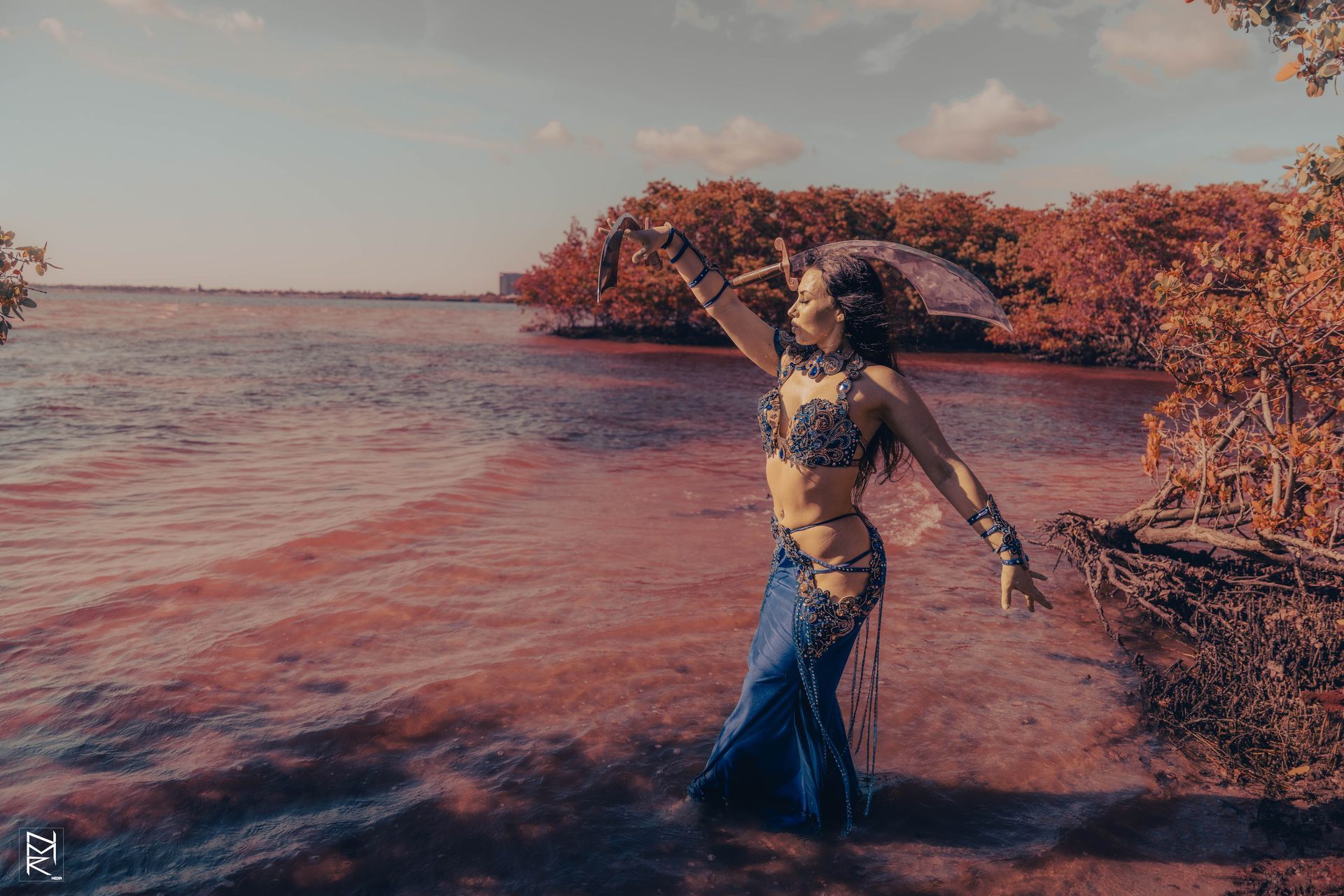 A photo of the Belly Dancer Azeeria Azizah in the water at cypress beach, Tampa Fl