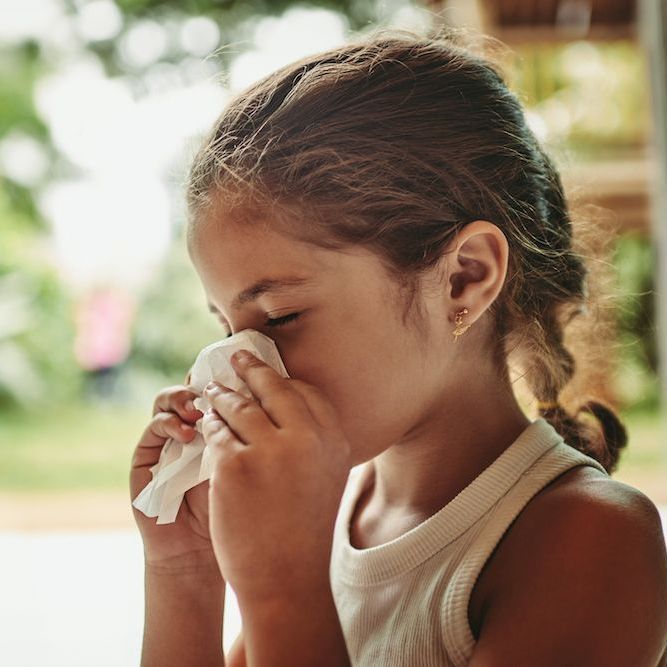 Girl Sneezing