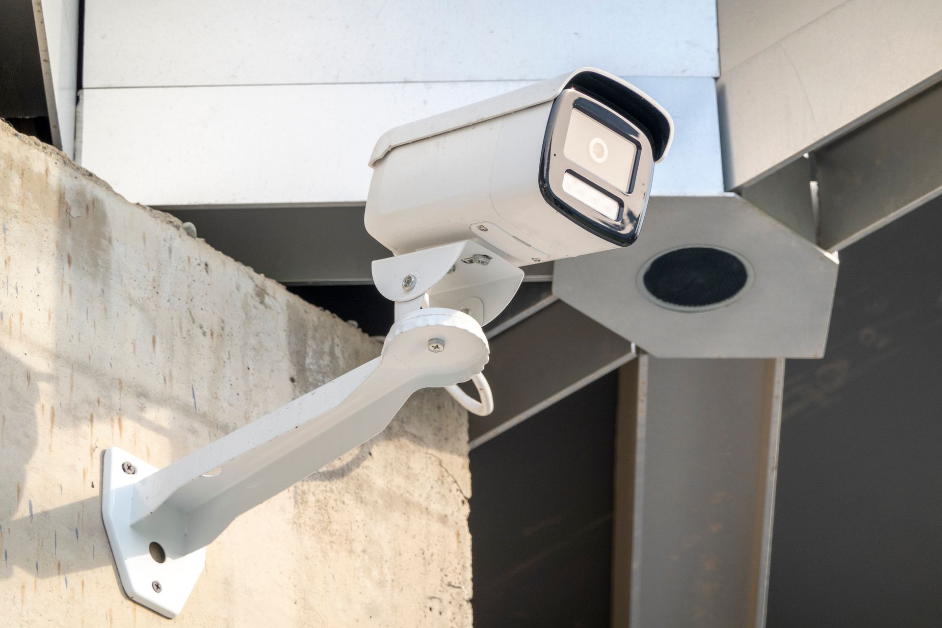 Surveillance cameras on a commercial building top.