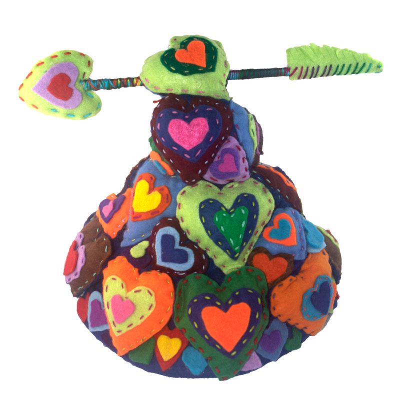 A colorful sculpture of hearts with an arrow sticking out of it