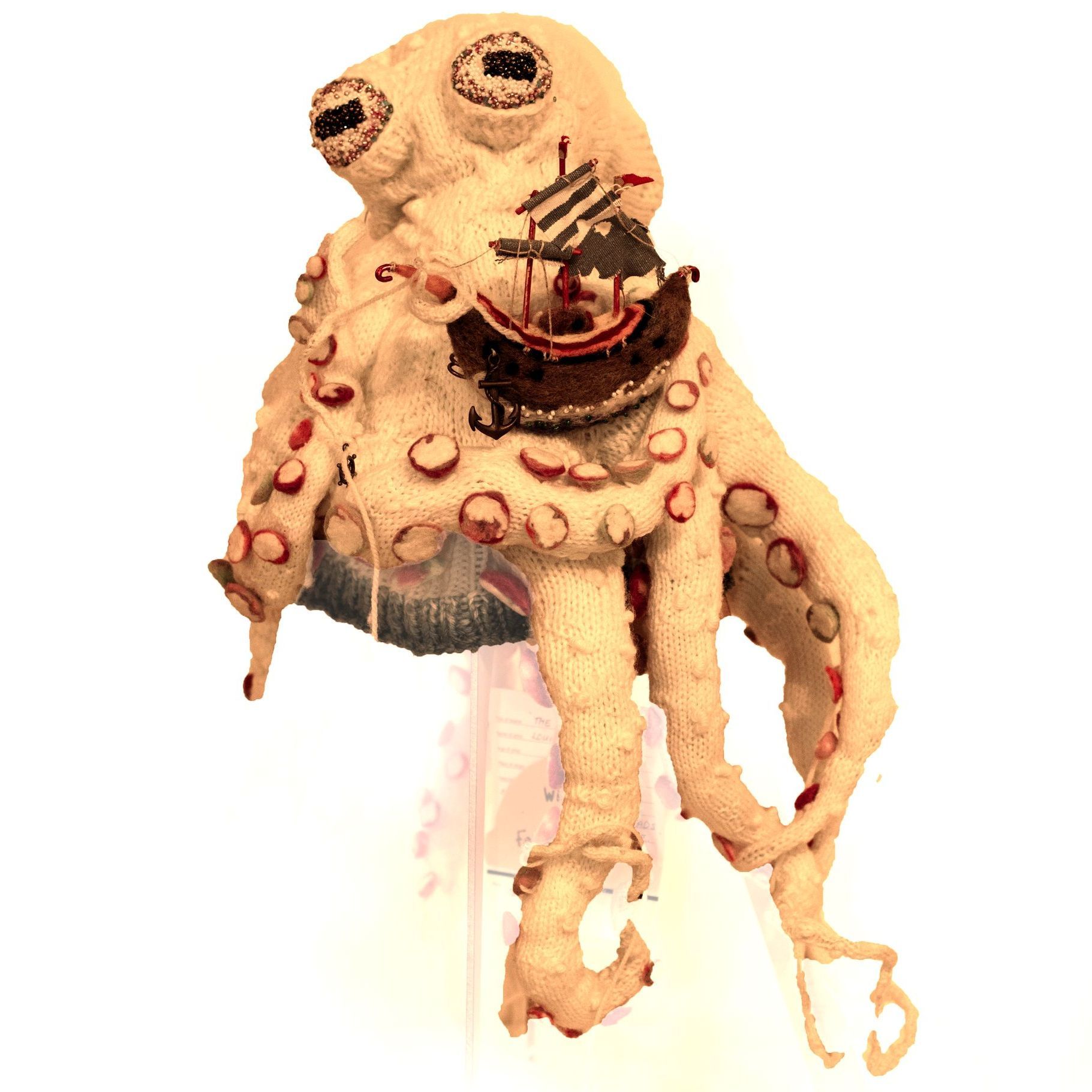 A statue of an octopus with a fork in its mouth