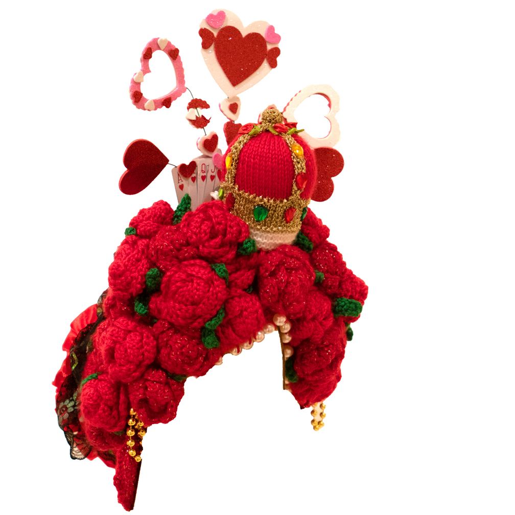 A red hat with a crown and hearts on it