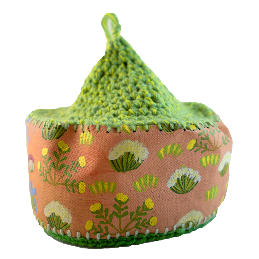 A pink and green item with flowers on it