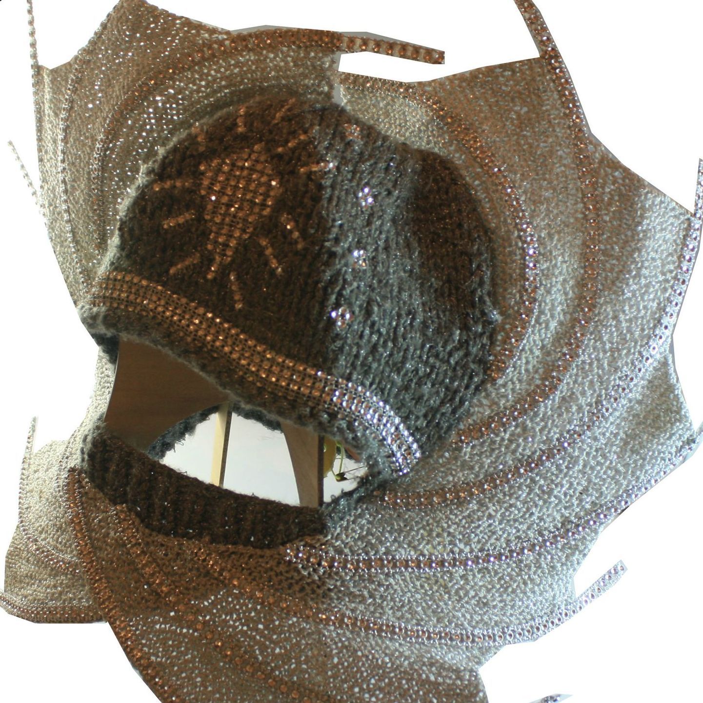 A close up of a hat with rhinestones on it