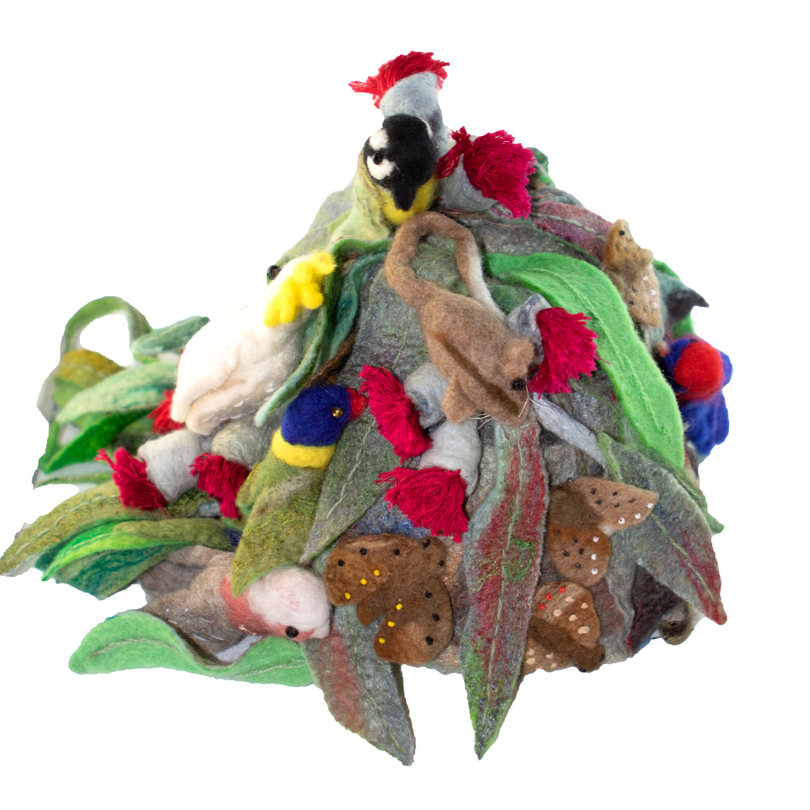 A bunch of stuffed animals are sitting on top of each other