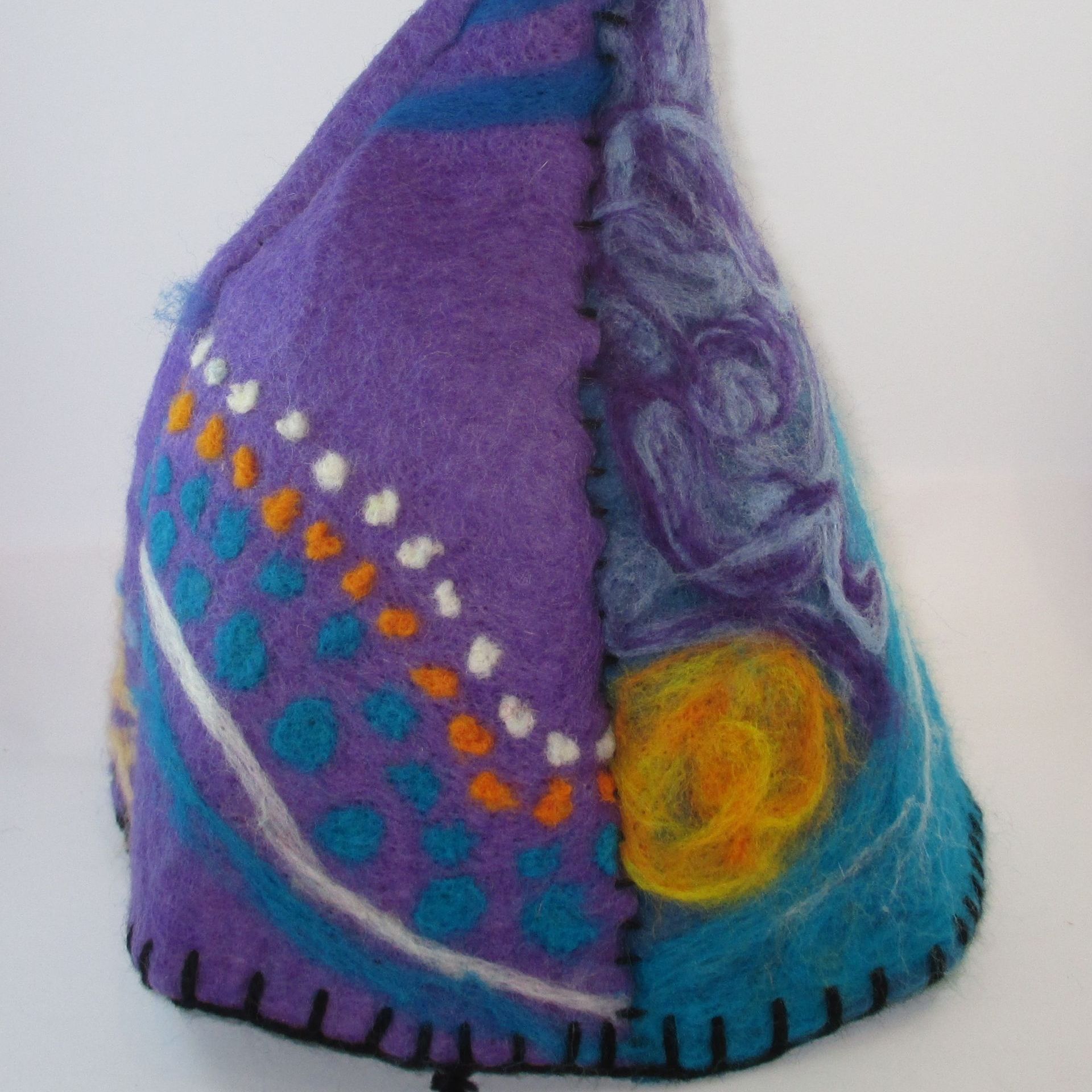 A purple and blue hat with a yellow circle on it