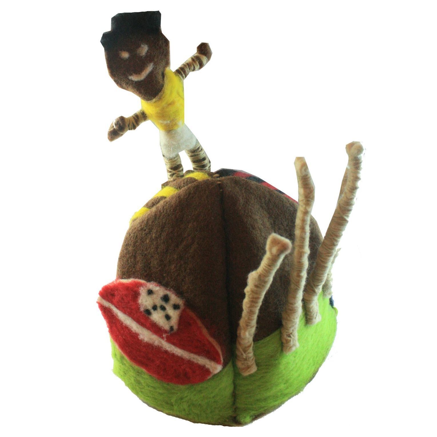 A stuffed toy of a man standing on top of a tennis ball