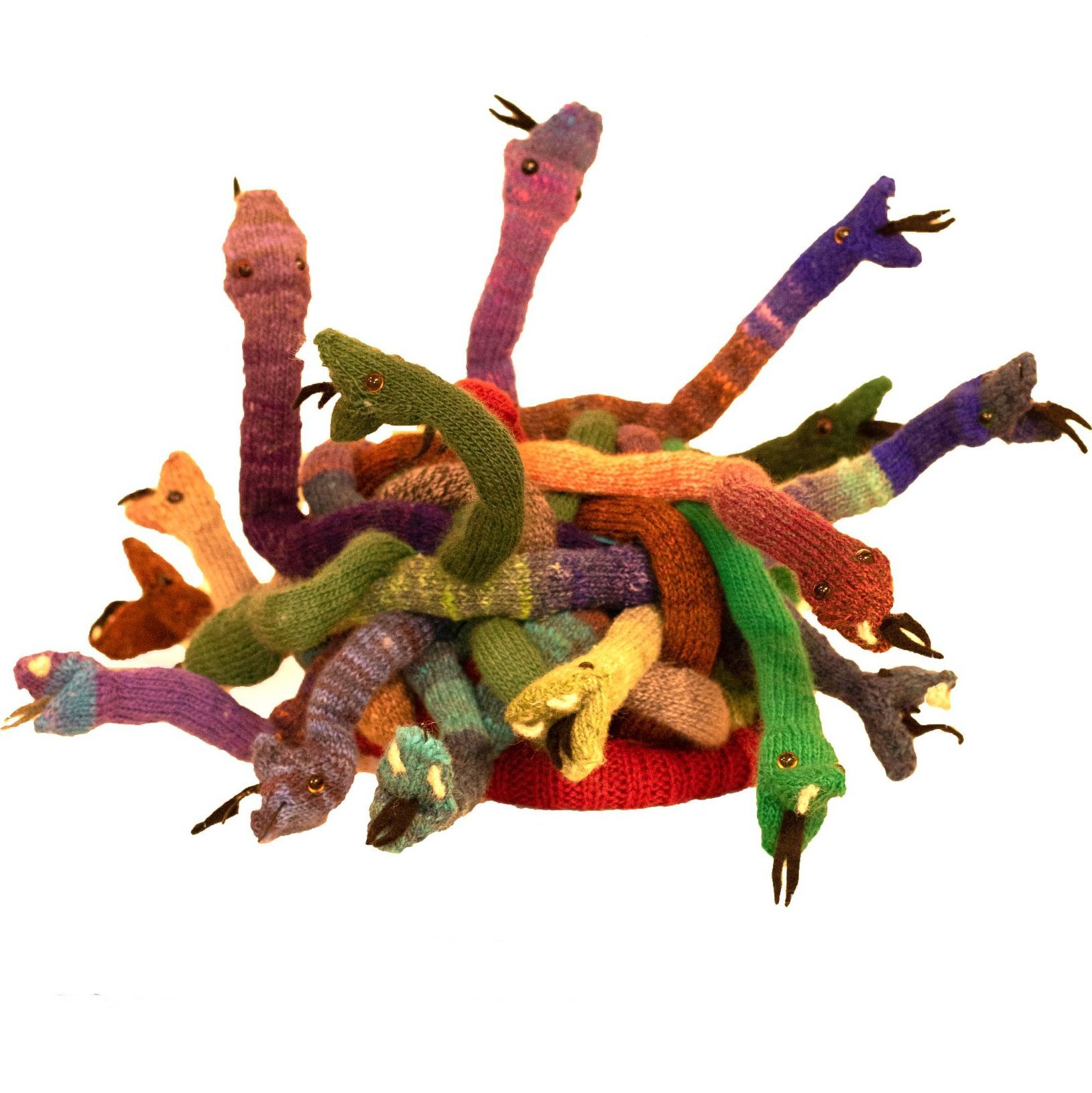 A bunch of stuffed snakes are stacked on top of each other