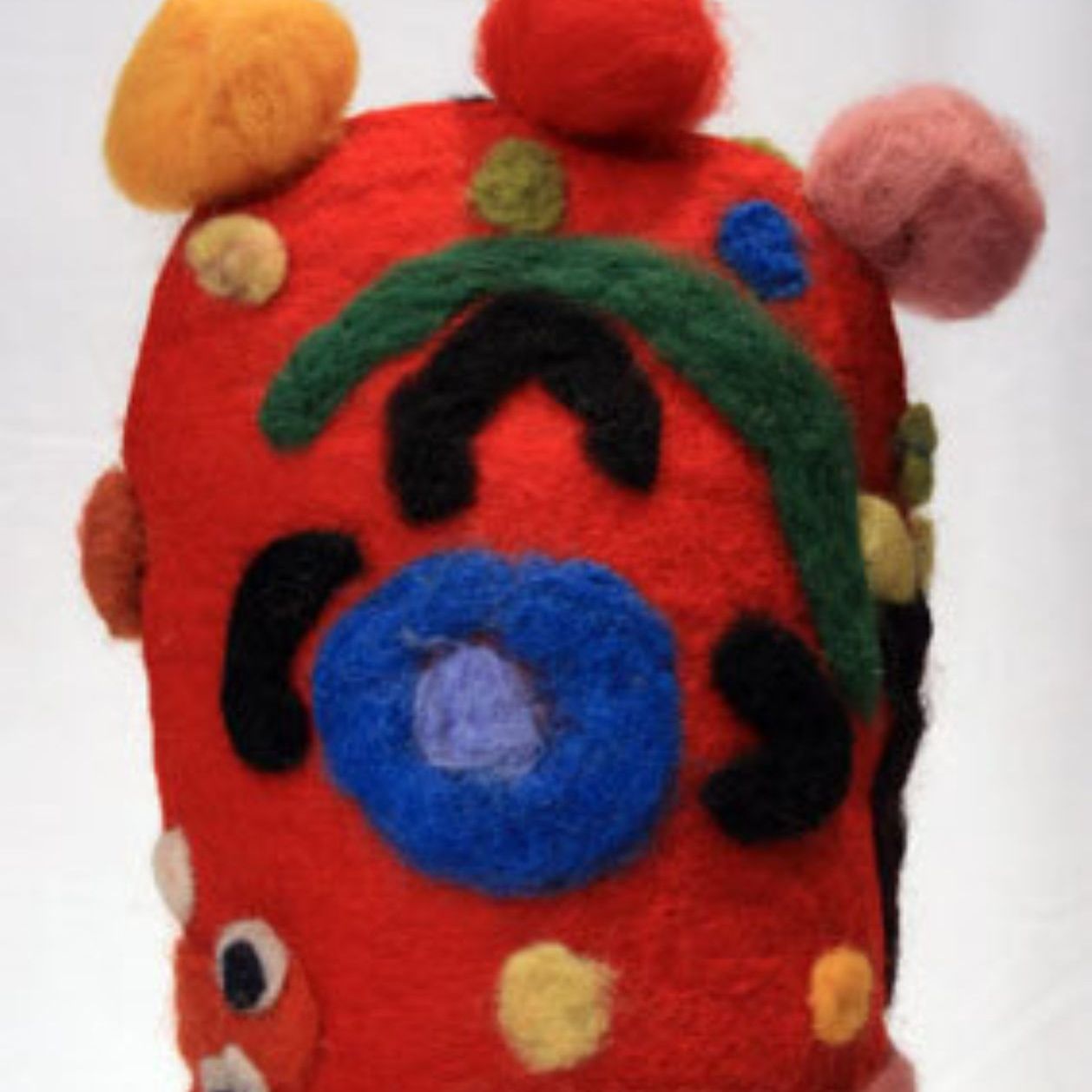 A red hat with a blue flower on it