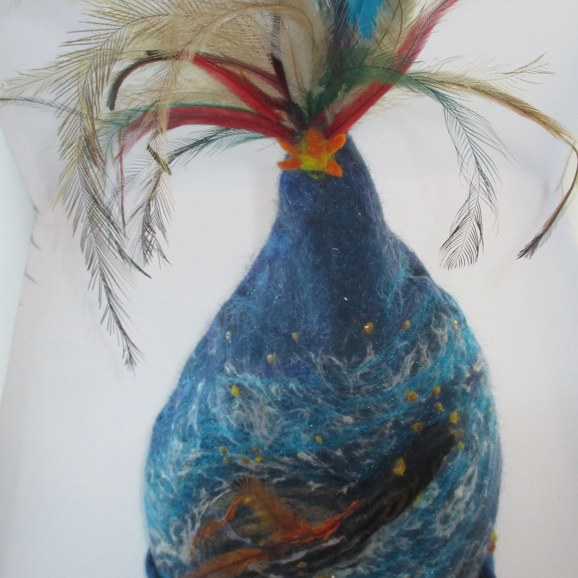 A blue bird with feathers on it 's head