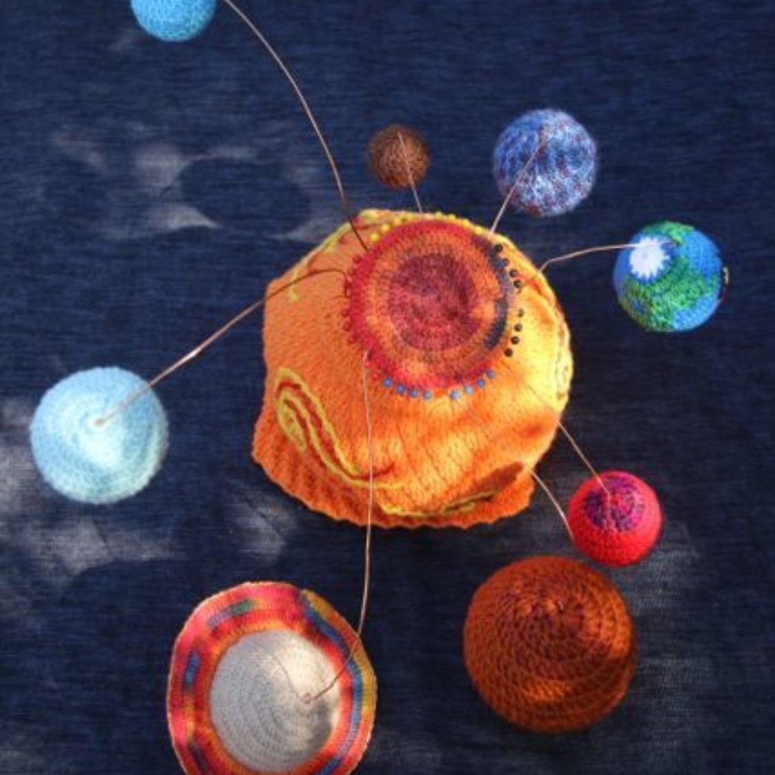 A model of the solar system made out of yarn