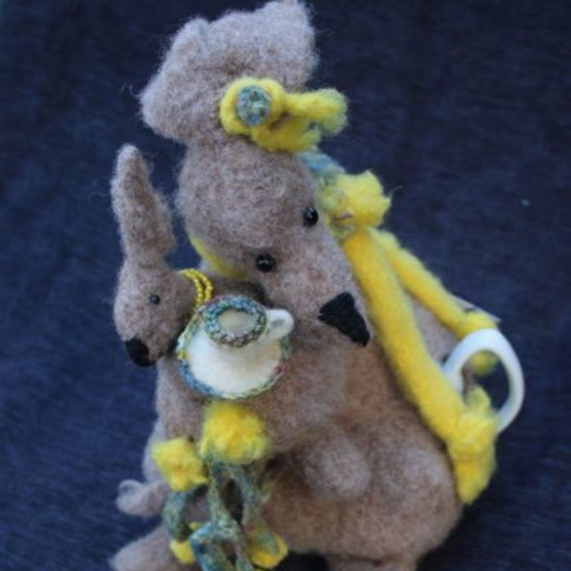 A stuffed kangaroo with a baby kangaroo on its back