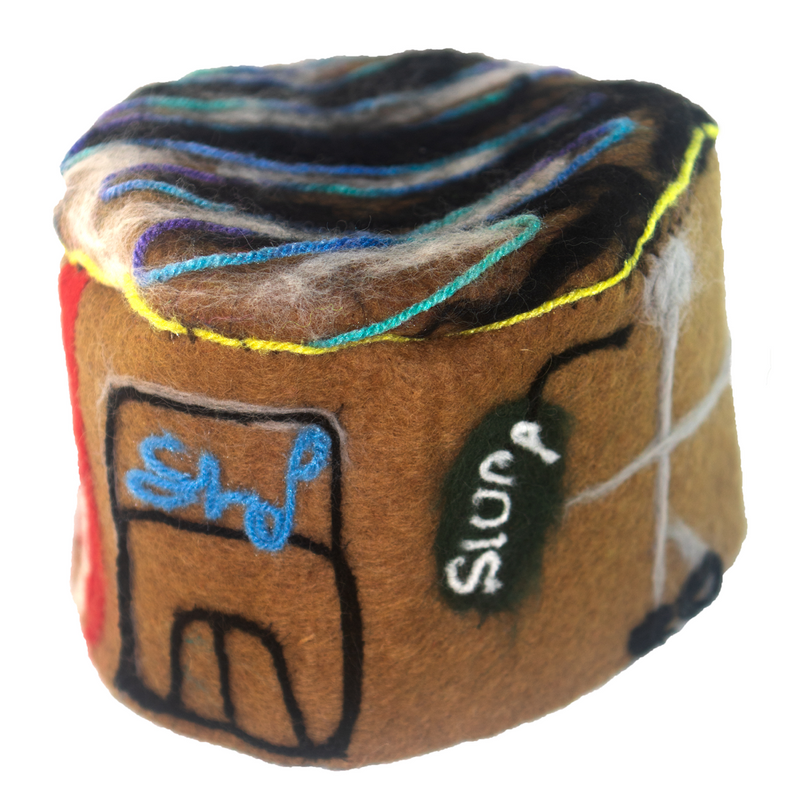 A brown cylinder with the word slump written on it