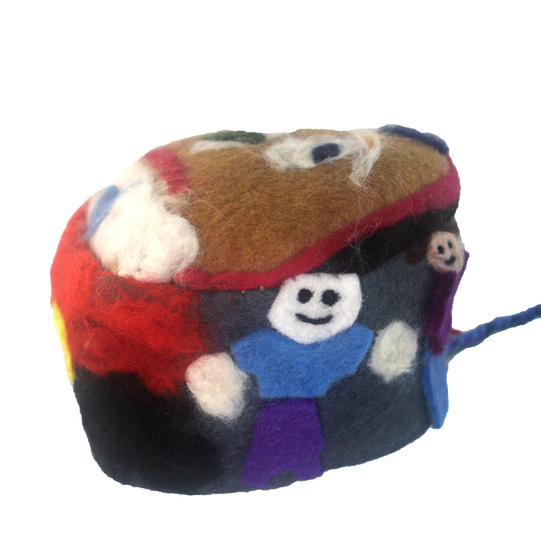 A stuffed animal with a smiley face on it