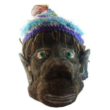 A close up of a mask with a hat on it