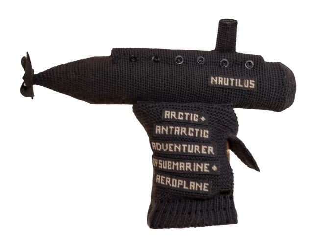 A knitted submarine with the name nautilus on it