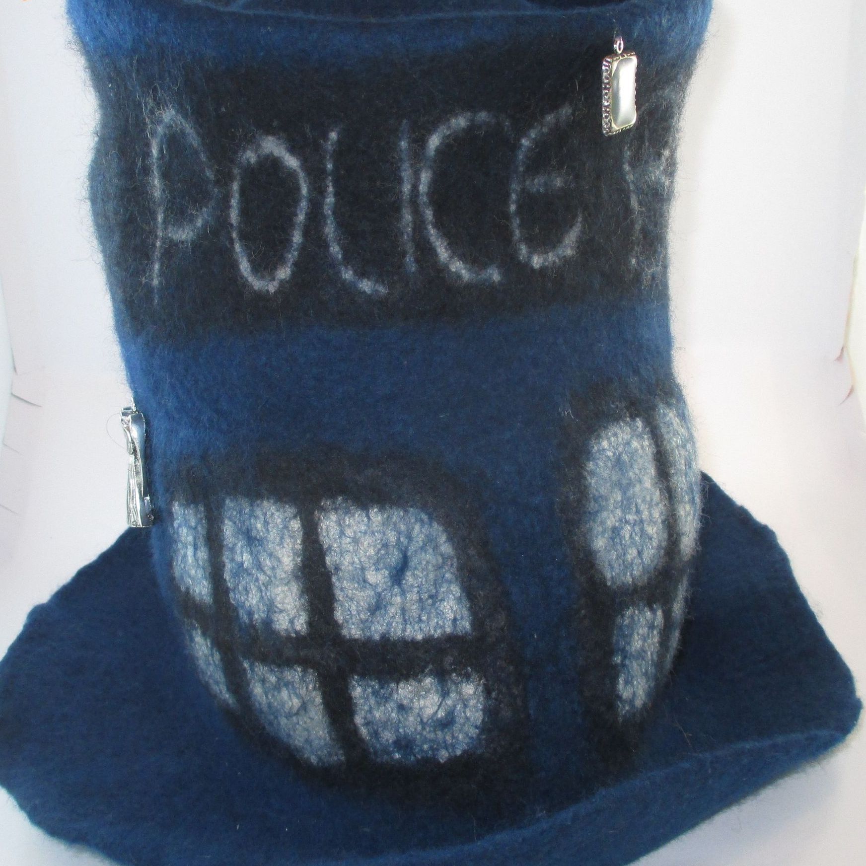 A blue top hat with the word police written on it