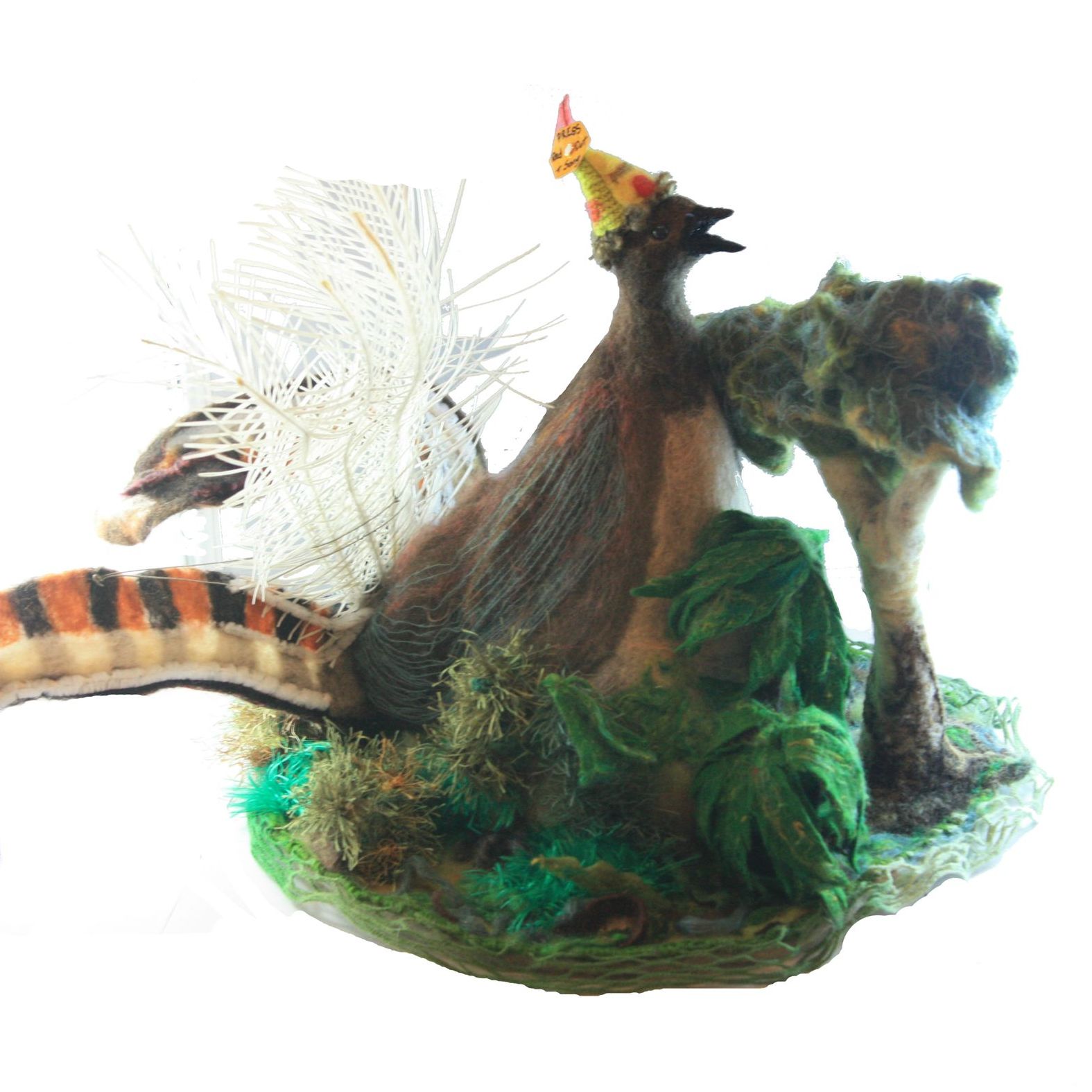 A statue of a bird sitting on top of a tree