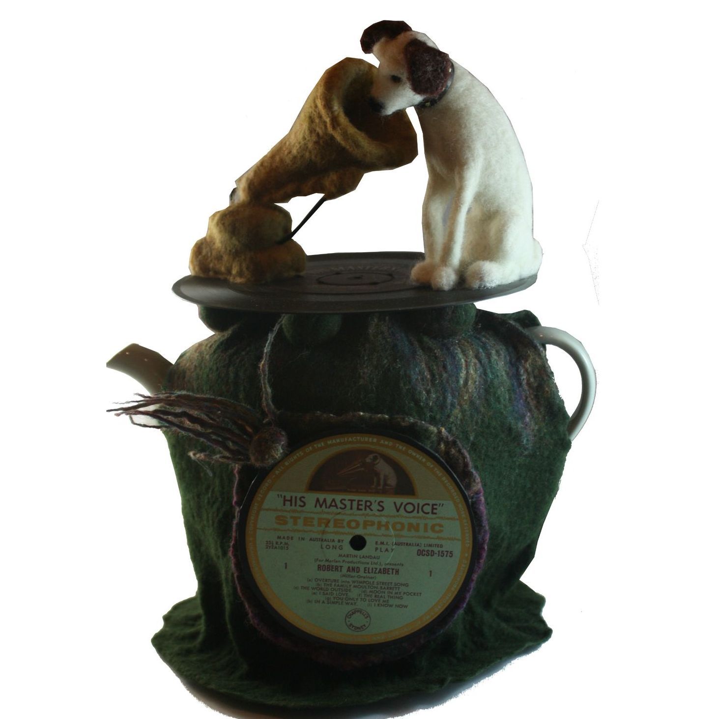 A statue of a dog on top of a record labeled masters voice