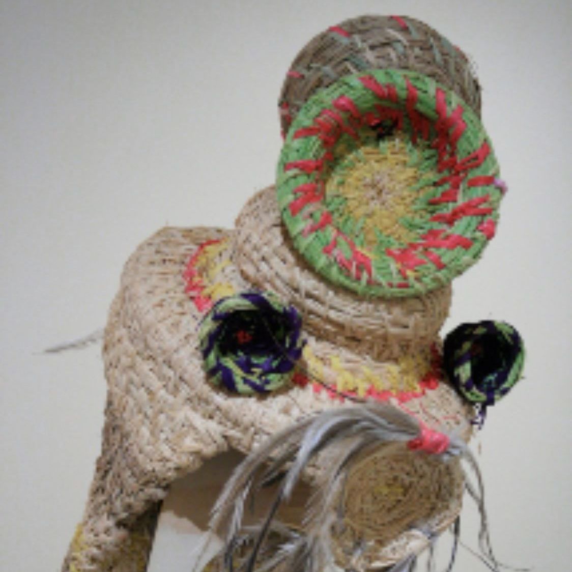 A close up of a stuffed animal with a hat on