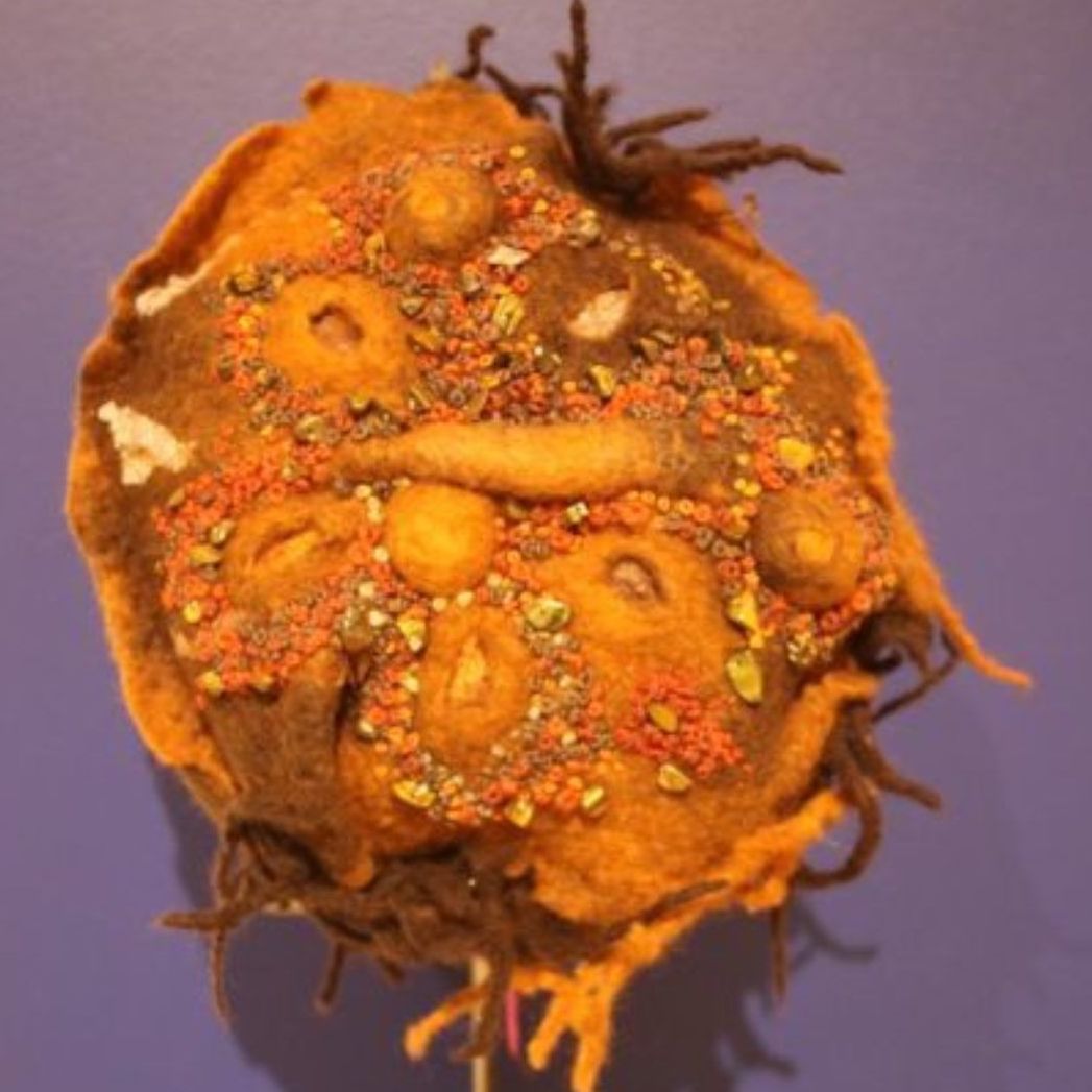 A close up of a stuffed animal on a purple background