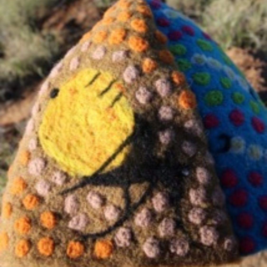 A stuffed animal with a smiley face on it