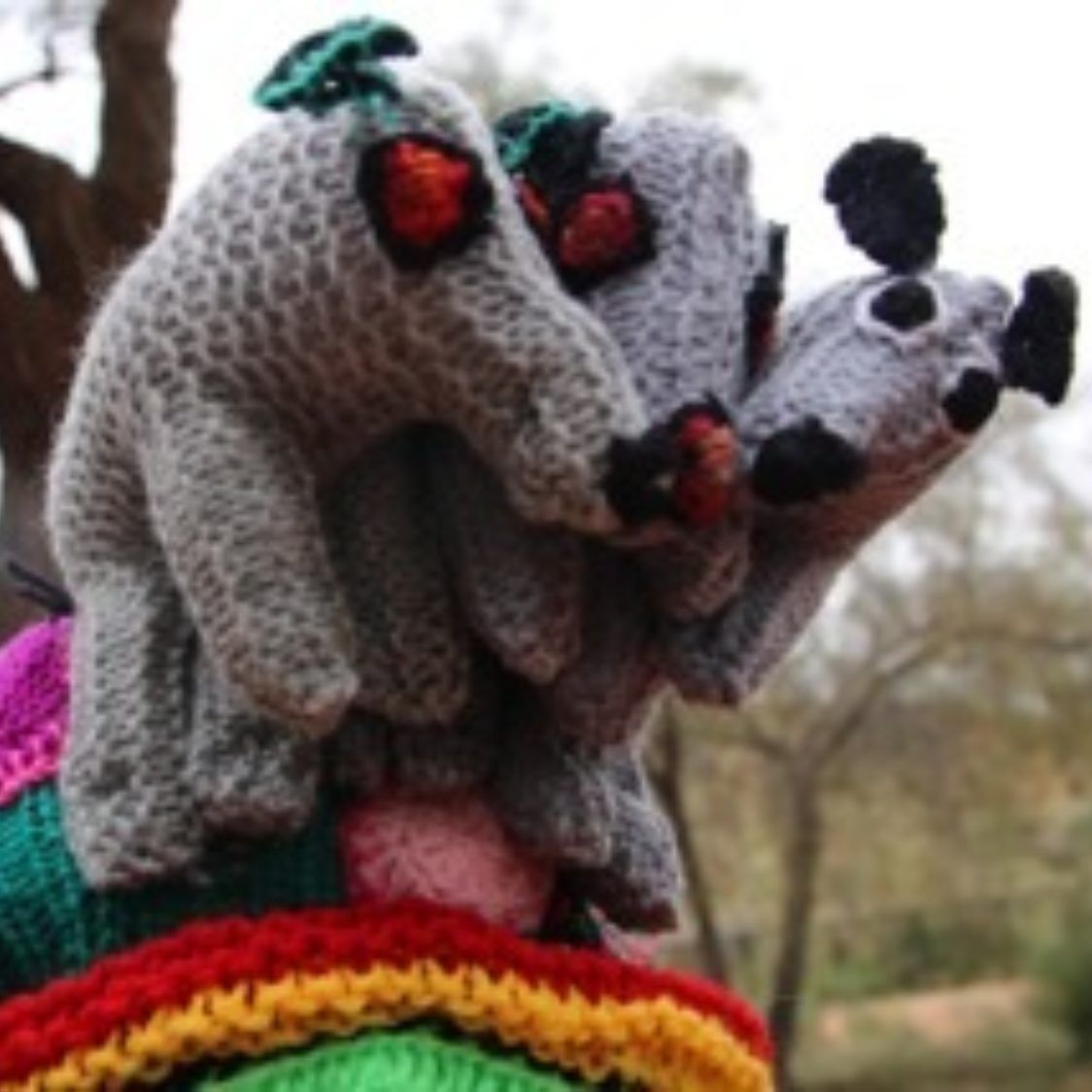 A bunch of stuffed animals are sitting on top of each other