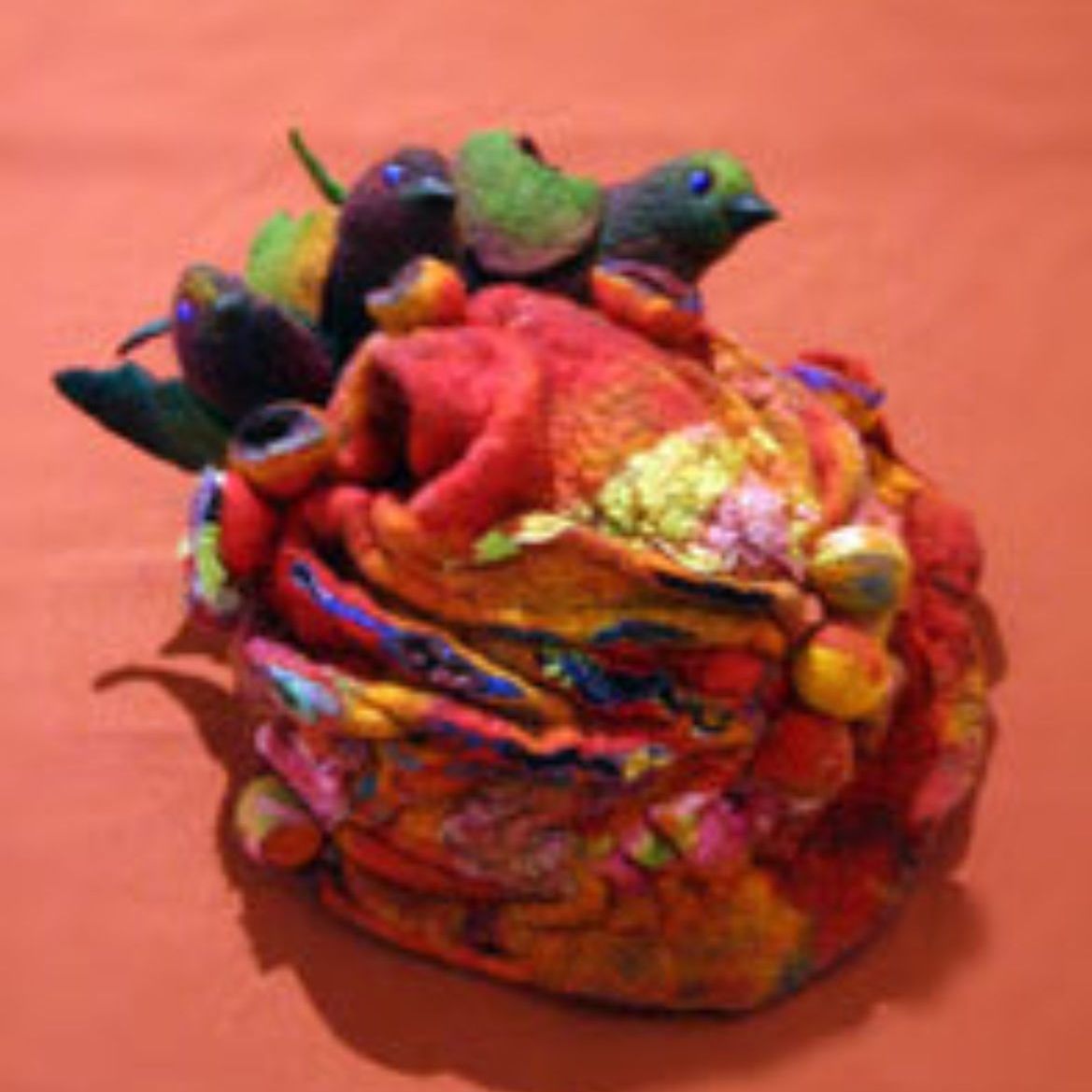 A colorful object with birds on top of it