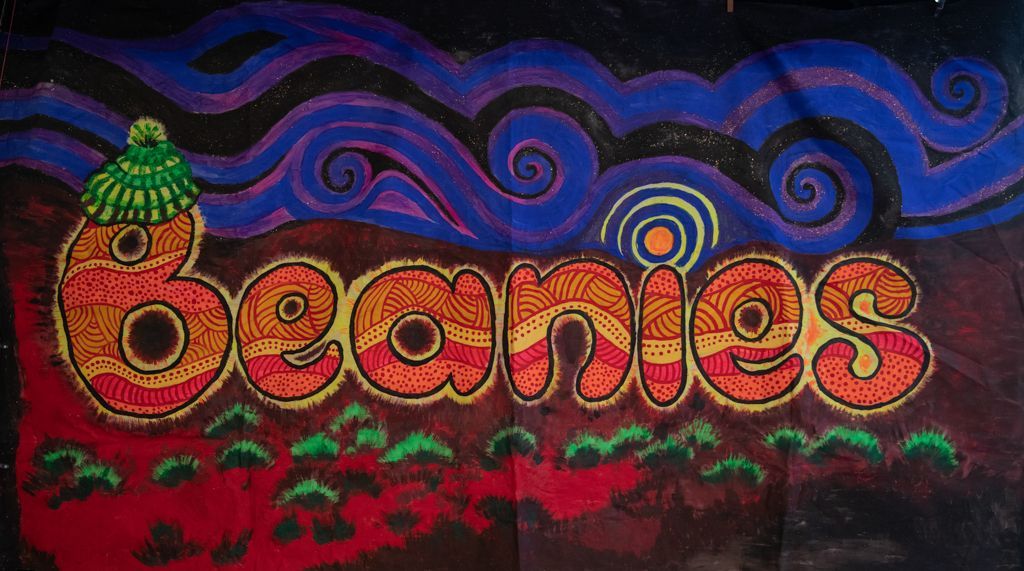 A colorful sign that says beanies on it
