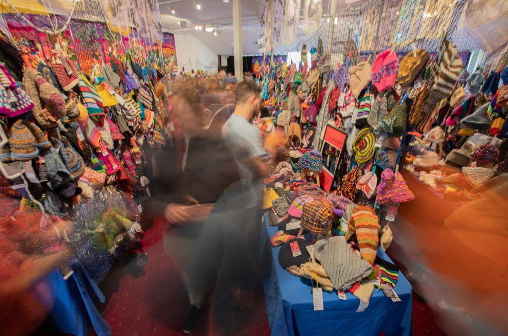 A blurry picture of a room filled with lots of colorful items.