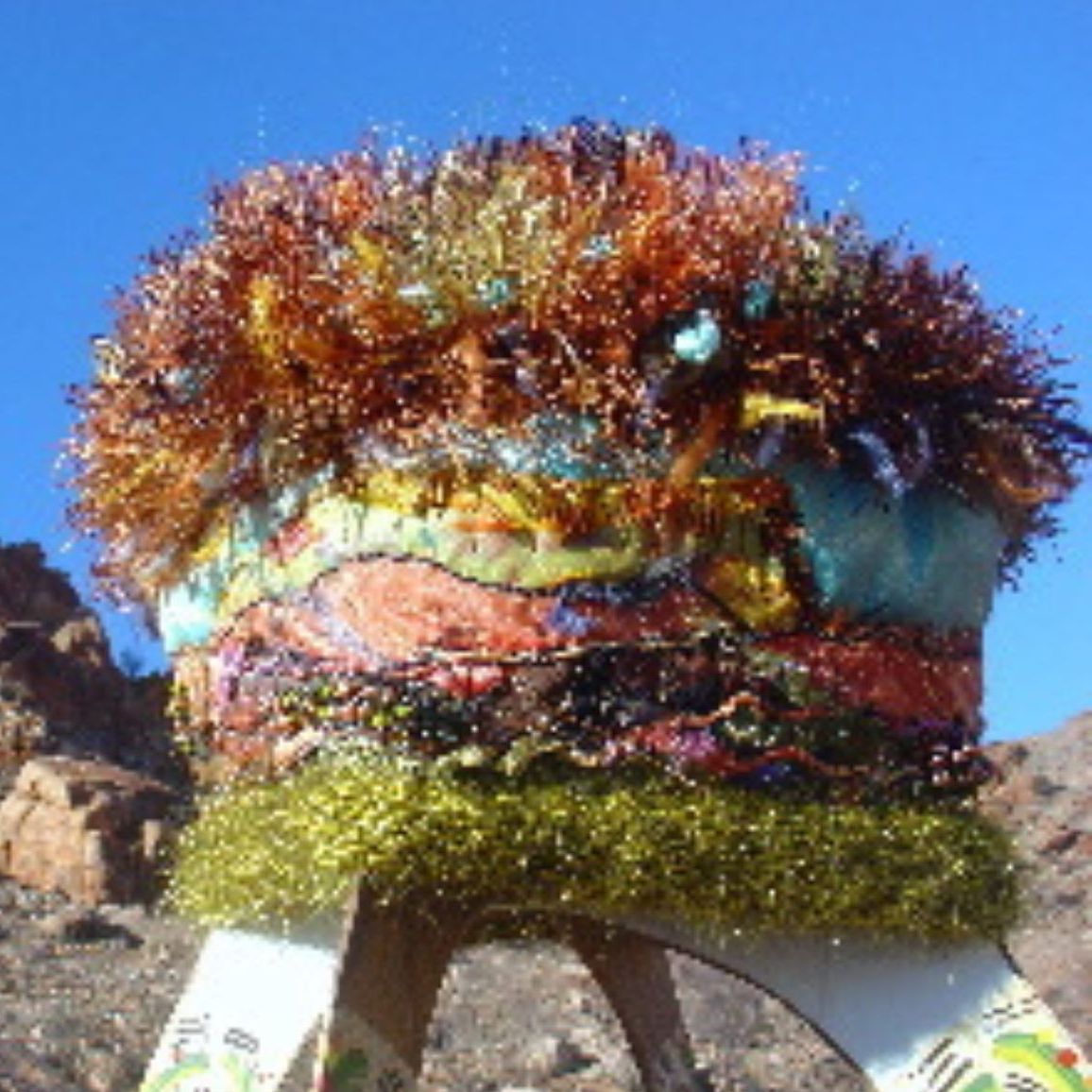 A colorful hat with a tag that says ' a ' on it