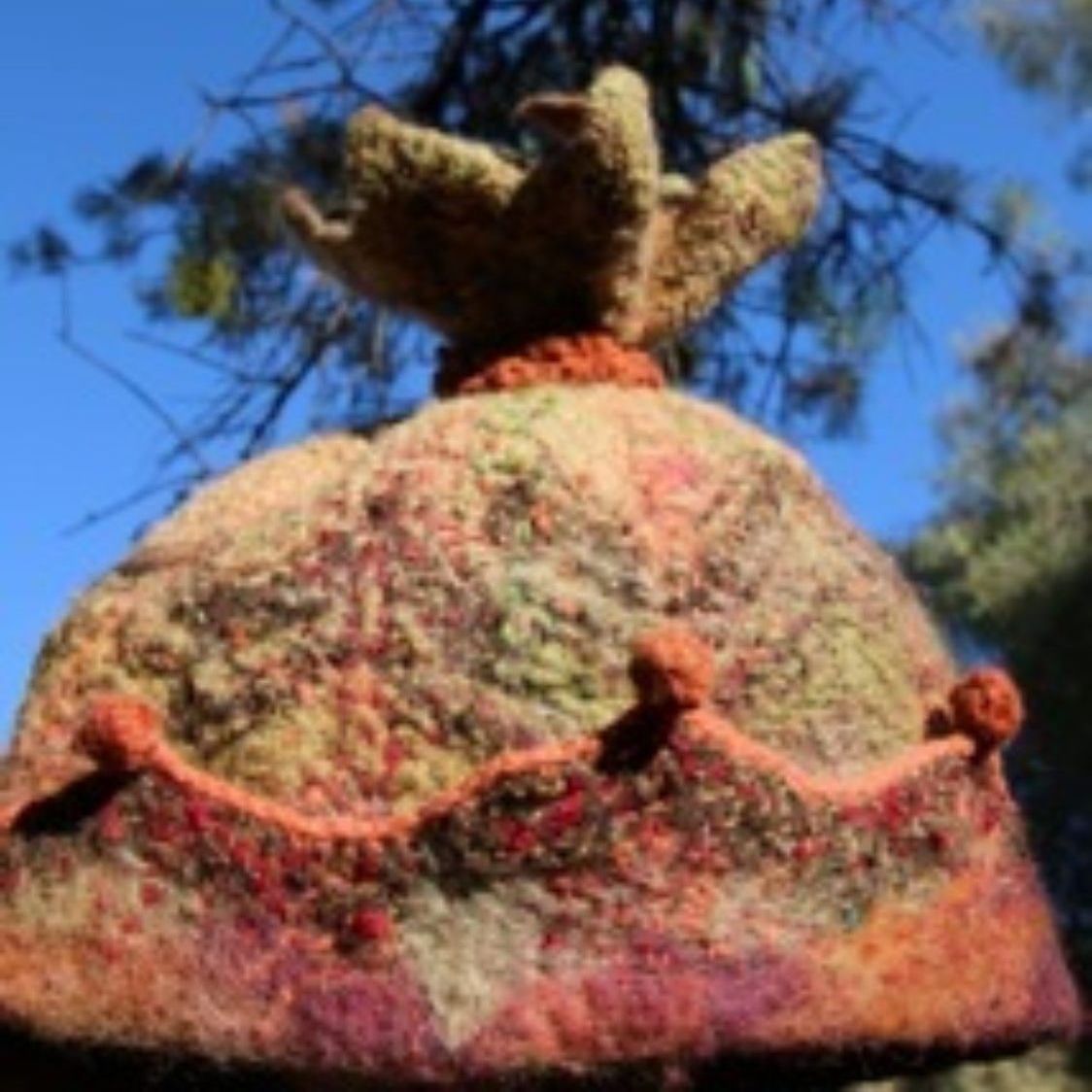 A colorful hat with a crown on top of it