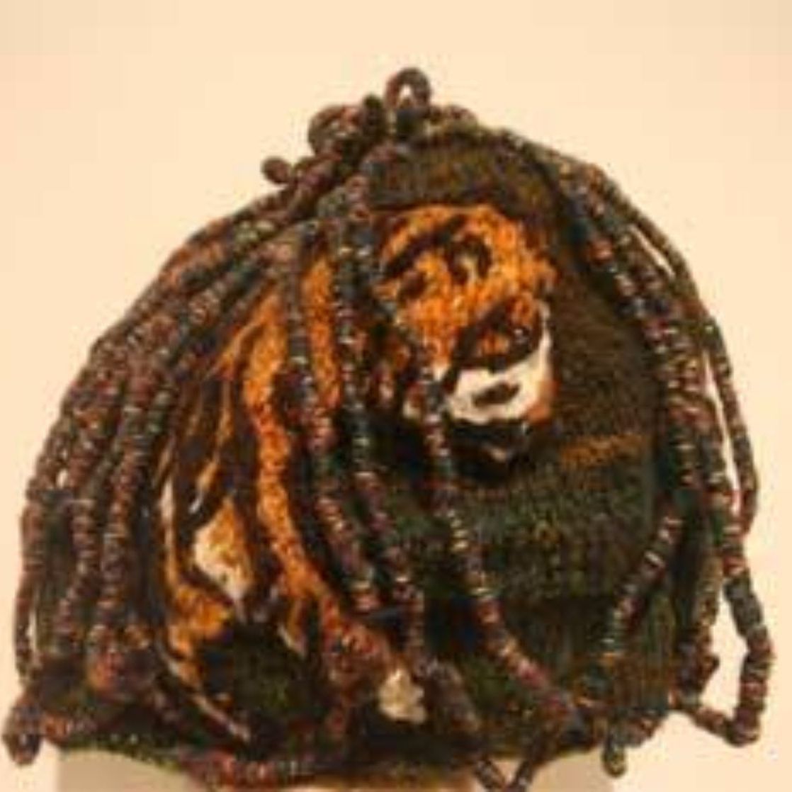 A painting of a tiger with dreadlocks on its head