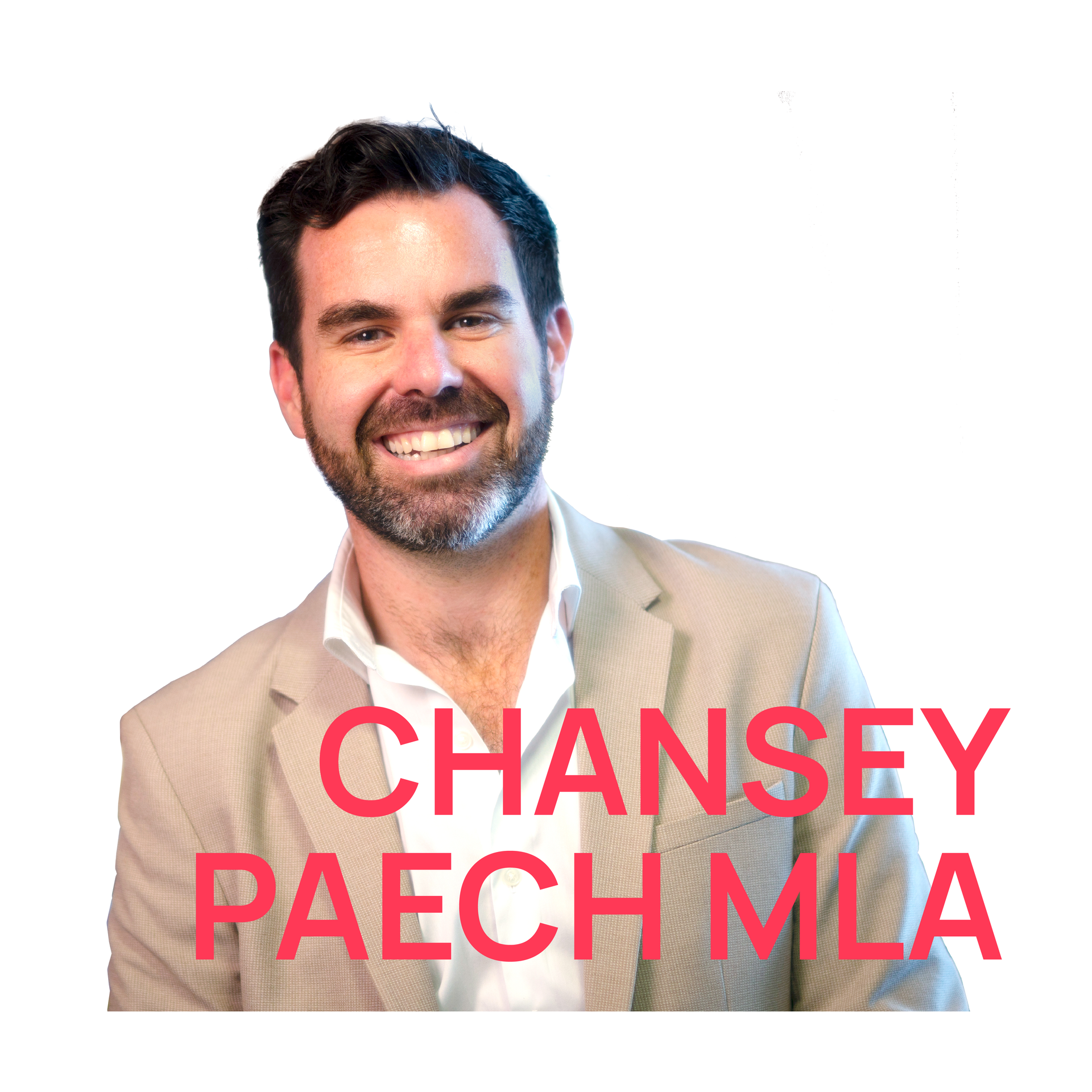 A man with a beard wearing a tan suit and white shirt.