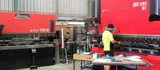 Man working machinery Man working machinery