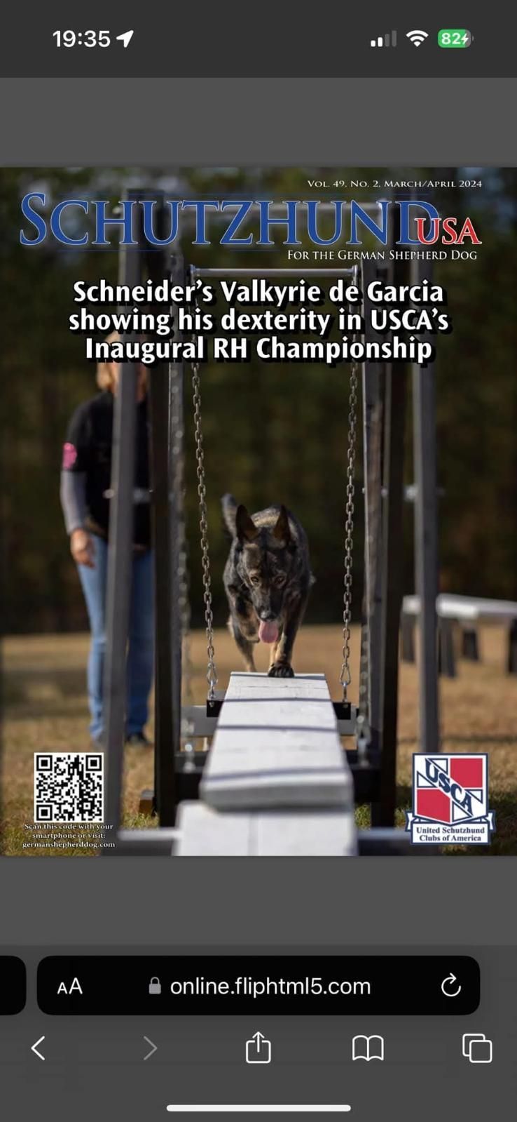 A dog running an agility course on the cover of a Schutzhund USA magazine.