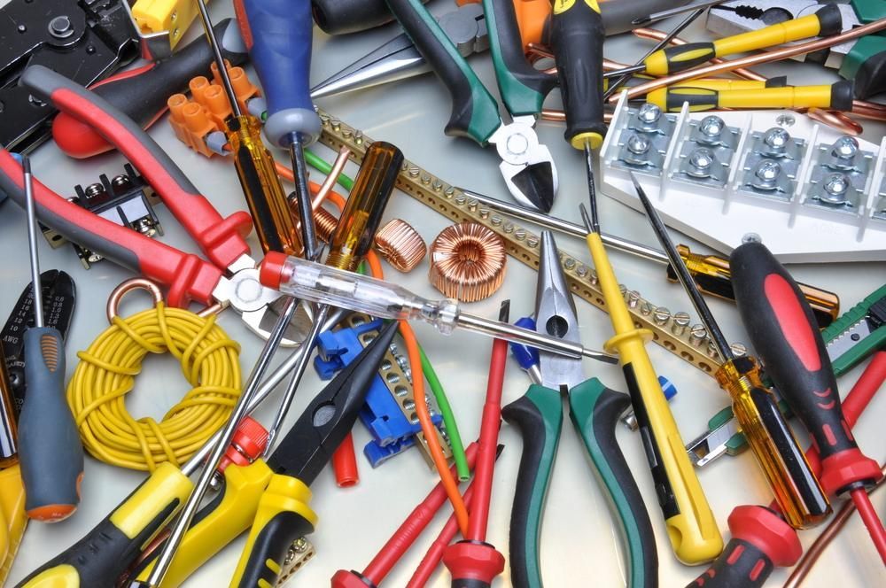 A Bunch of Tools Including Pliers and Screwdrivers on a Table — Instant Spark Electrical in Glen Isla, QLD