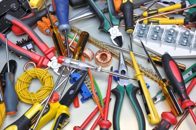 A Bunch of Tools Including Pliers and Screwdrivers on a Table — Instant Spark Electrical in Glen Isla, QLD