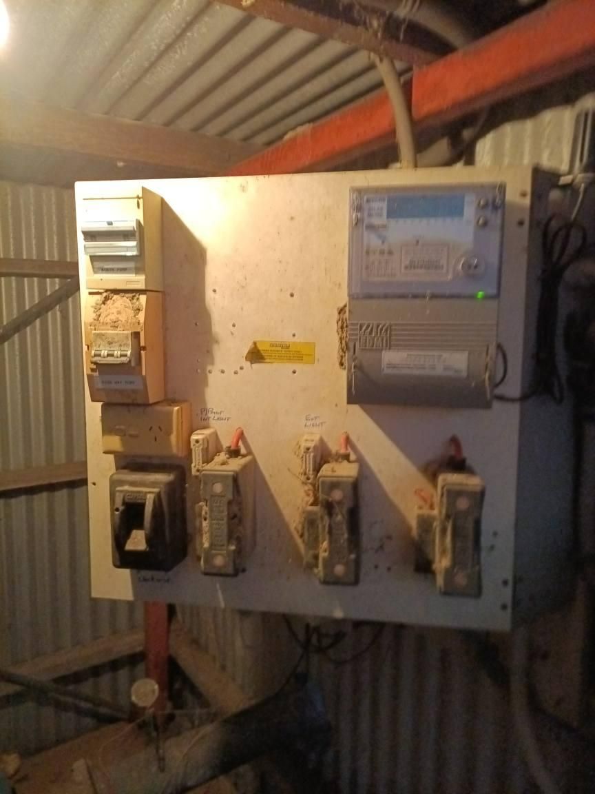 A Wall With a Bunch of Electrical Equipment on It — Instant Spark Electrical in Glen Isla, QLD
