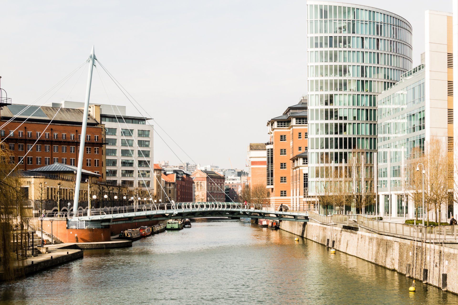 There is a bridge over a river in the middle of a city.