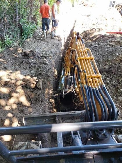 Excavator Digging for Pipe Lines