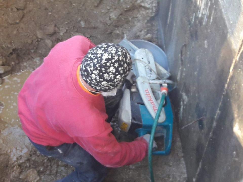 Worker Cutting a Concrete