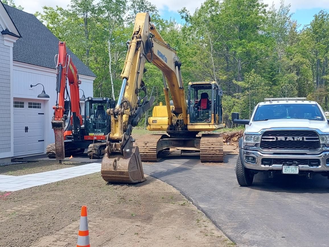 A ram truck is parked in front of a construction site.