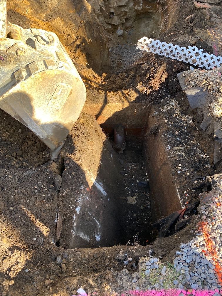 A bulldozer is digging a hole in the ground.