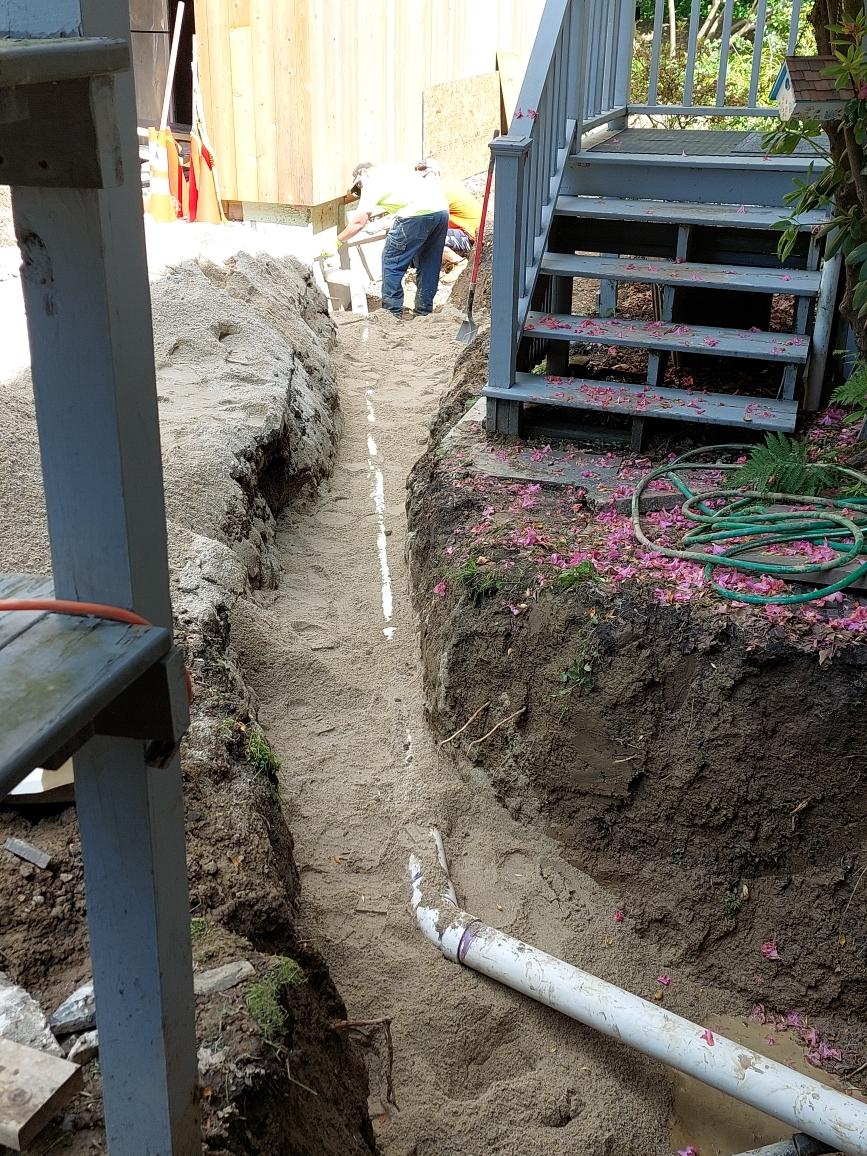 Worker Doing French Drain Installation