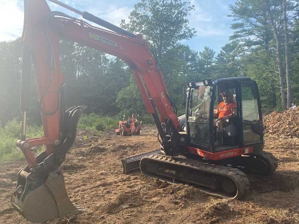 Man Operating a Backhoe