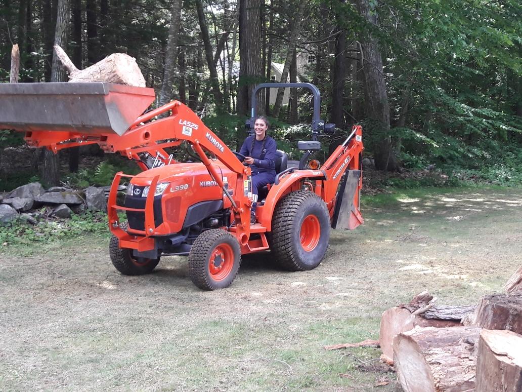 Woman Operating a Front Loader