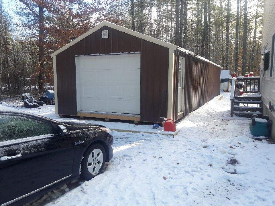 A Shed With Car in Front