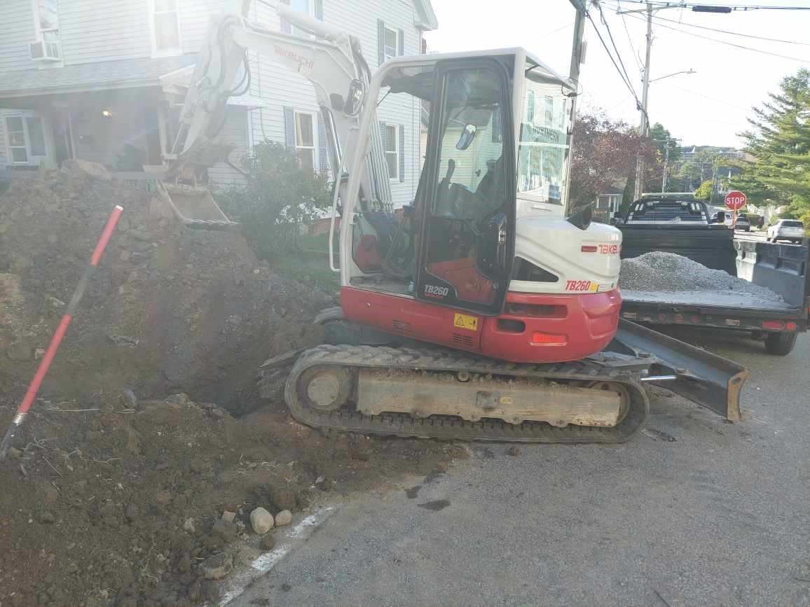 Backhoe Operated by a Professional Worker Doing Residential Excavation